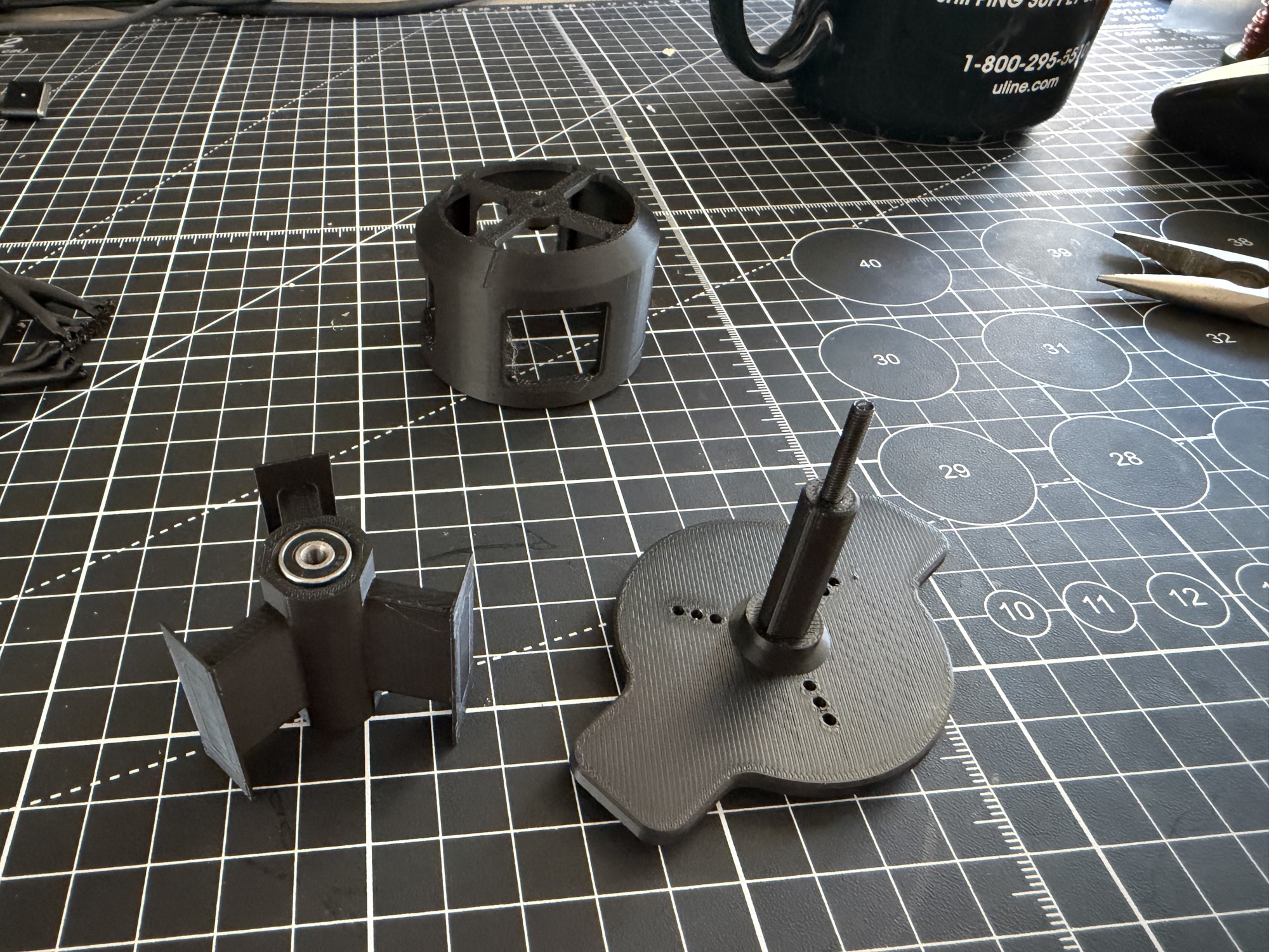 Second motor prototype's redesigned 3D-printed rotor, stator, and base